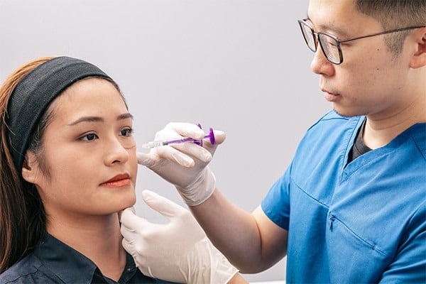 photo of a lady taking the dermal cheek fillers treatment